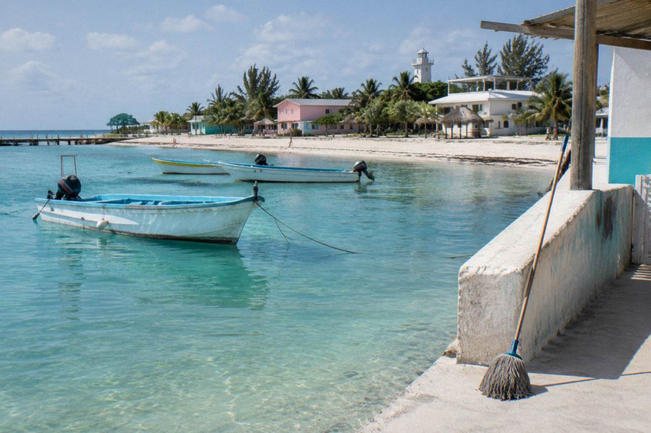 Calm turquoise shallows along a white sand beach on Isla Mujeres