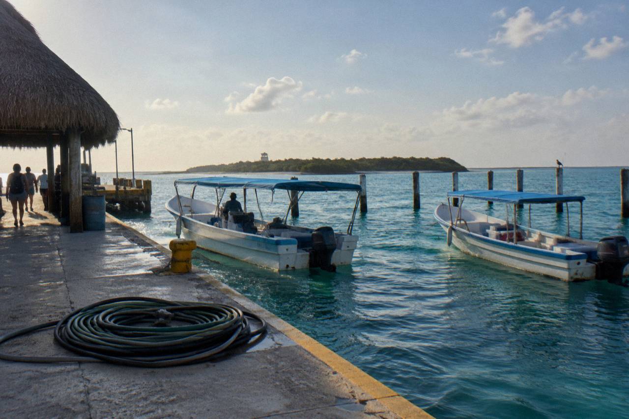 Isla Contoy: small boats at the Isla Mujeres dock before the crossing north
